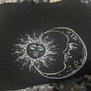 Oversized black crew neck moon and sun sweatshirt